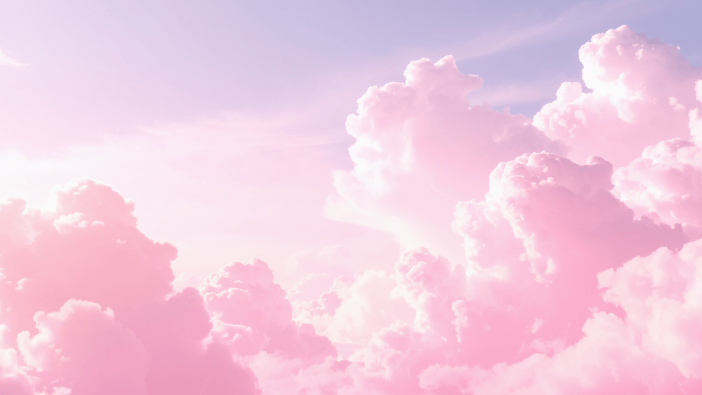 Soft pink clouds in a pastel sky with a dreamy, serene aesthetic.
